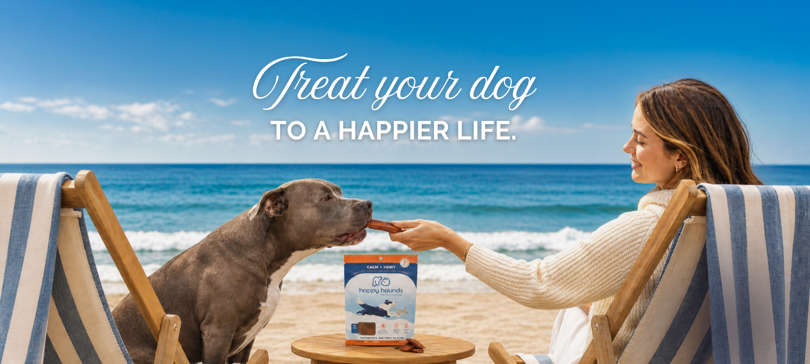 woman on beach with dog giving them happy hounds calming cbd dog treats for anxiety and joint pain