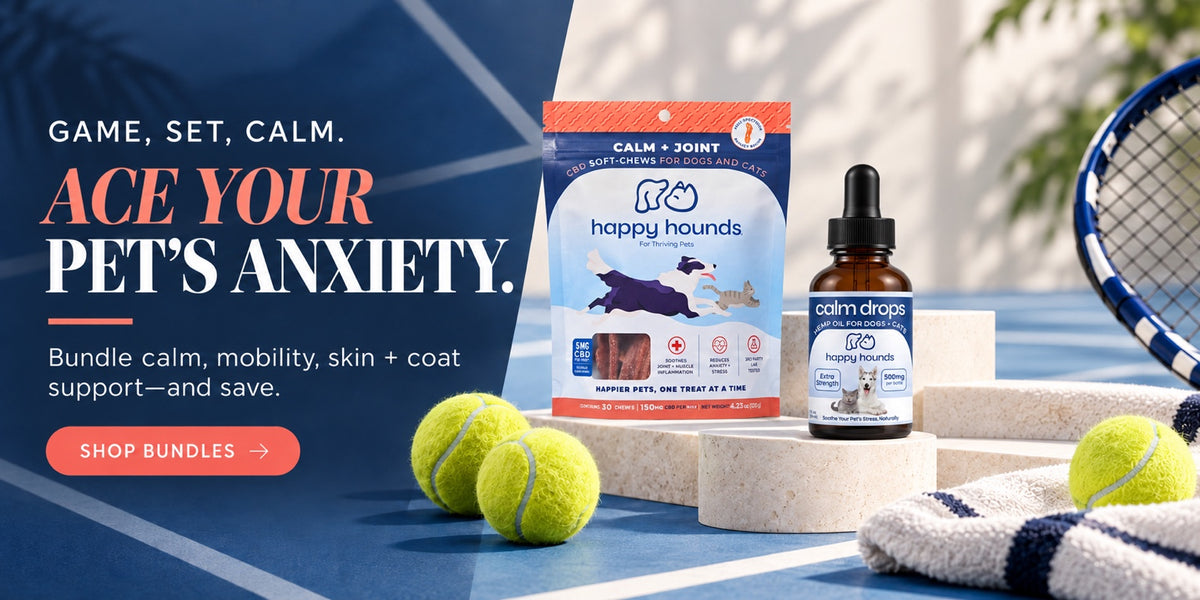Promotional product shot for a pet anxiety bundle on a tennis court background. Visible items include a bag of Happy Hounds Calm + Joint dog treats, a small amber dropper bottle labeled Calm Drops, tennis balls, a towel, and part of a tennis racket.